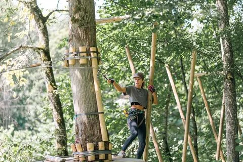 A Tree Climber Fully Engaged in Thrilling Adventure Activity in the Great O.. Stock Photos