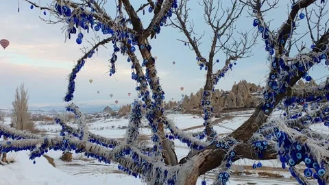 A tree with colored lanterns on the background of flying balloons. Stock Footage 139649850