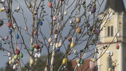Tree decorated with easter eggs at the church, stock video Stock Footage 108499171