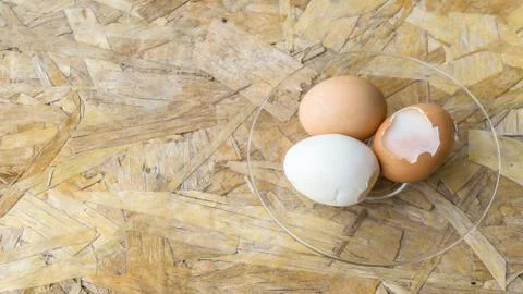 Tree eggs on a chopping board from above,soft boil egg, copy space for text. Stock Photos