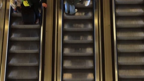 Tree Escalators in Metro going up and down, carrying people to and from the.. Stock-Footage 269319558