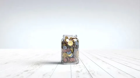 A tree grows on a coin in a glass jar, Money saving concept. Stock Footage 237927983