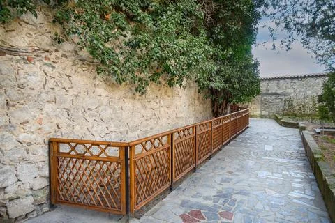 Tree grows on stone wall of Khan's Palace in Bakhchysarai. Crimea Stock Photos