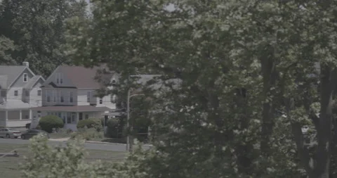 Tree to Houses Pan 4K Stock Footage 145998352