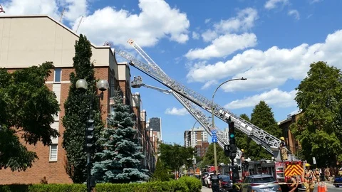Tree ladders moving in the same time at fire intervention Stock Footage 116079791