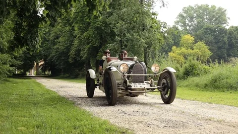 Tree-lined avenue with old white car Stock Footage 89765569