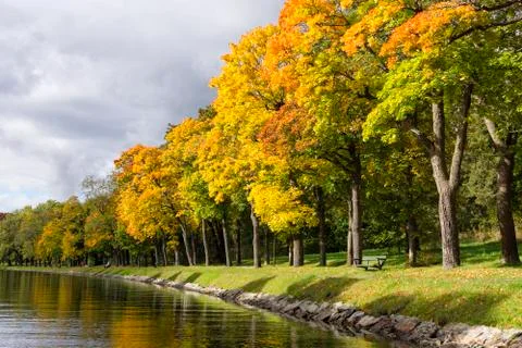 Tree lined channel in the fall Stock Photos