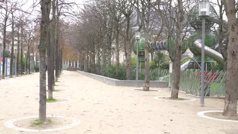 Tree-Lined Pathway in a Paris Park Featuring Sculptures and Lush Greenery Stock Footage 304795041