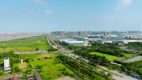 Tree lined road beside an automotive campus in Guangzhou China Video stock 345957911