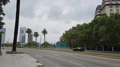 Tree-Lined Road With Palm Trees and Skyscrapers in Distance, Obelisco, Argentina Stock Footage 306461202