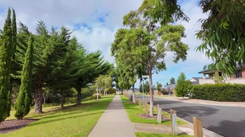 Tree-lined suburban pathway or sidewalk in Melbourne, Australia Vídeos de archivo 308047978