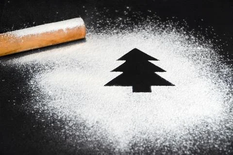 Tree made of flour on a black background. Preparing for Christmas Stock Photos