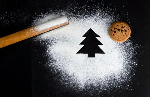 Tree made of flour on a black background. Preparing for Christmas Stock Photos