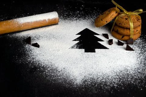 Tree made of flour on a black background. Preparing for Christmas Stock Photos