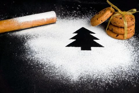 Tree made of flour on a black background. Preparing for Christmas Stock Photos