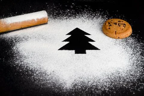 Tree made of flour on a black background. Preparing for Christmas Stock Photos