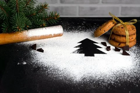 Tree made of flour on a black background. Preparing for Christmas Stock Photos