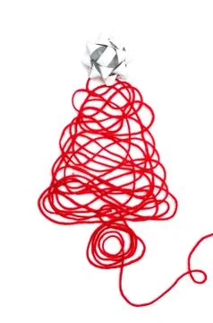 A tree made of red thread and ribbon on white background Foto stock