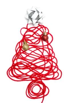 A tree made of red thread and ribbon, ball on white background Stock Photos