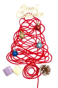 A tree made of red thread and merry christmas text, ball, small box, pine con Stock Photos
