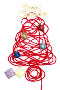 A tree made of red thread and merry christmas text, ball, small box on white  Stock Photos