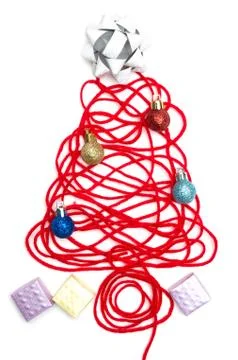 A tree made of red thread and ribbon, ball, small box on white background Stock Photos
