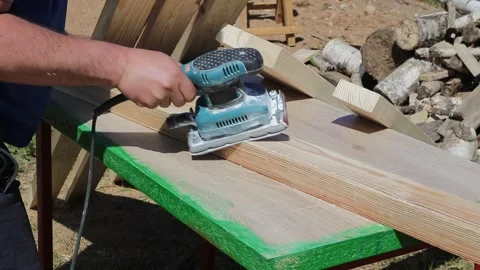 Tree. natural wood in the shape of a rectangle. work piece. a man uses a tool to Stock Footage 243663488