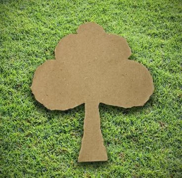 Tree paper attach on grass background Stock Photos