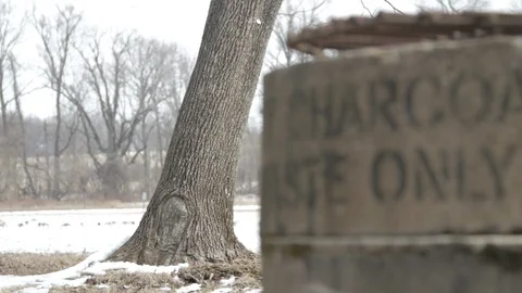 Tree rack focus to cement grill “Charcoal only” close up 스톡 동영상 104310987