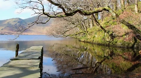 Tree Reflections over beautiful water with stone pier Lake District Countryside Stock-Footage 40750705