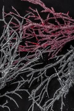 Tree roots or branches covered by sequins and glitters of silver and pink col 스톡 사진