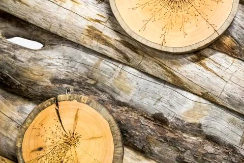 Tree saw with a pattern on the background of logs Stock Photos