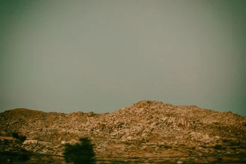 Tree shadow on the landscape mountains on a road trip. 스톡 사진