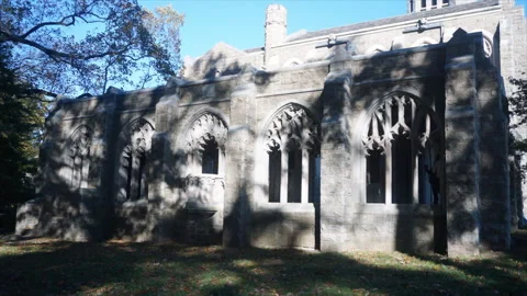 Tree shadows move in time-lapse motion across cloisters at Washington Memorial Stock Footage 314876610
