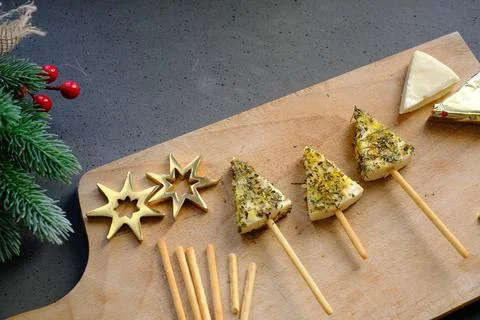 Tree-shaped cheese snack on a cutting board Stock Photos