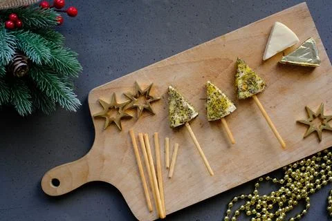 Tree-shaped cheese snack on a cutting board Stock Photos
