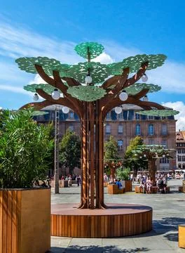 Tree shaped streetlight bench on Cathedral Square in Strasbourg in summer Stock Photos