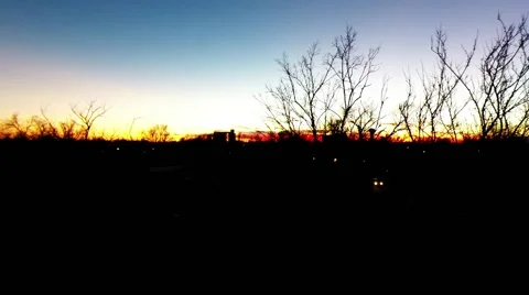 Tree top level sunset over the Kansas plains Video stock 44421670