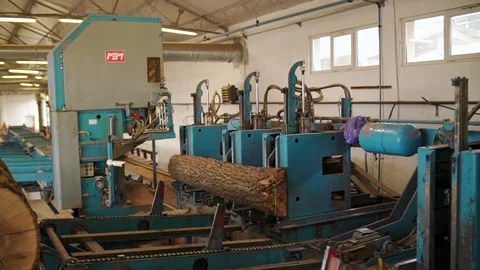 Tree Trunk Being Cut into Planks Machine Details Sawmill Interior Slow motion 動画素材 127825203