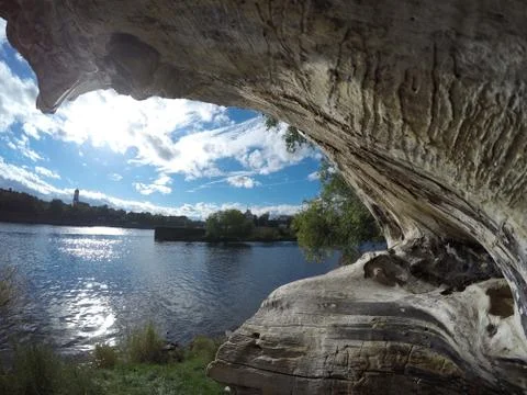 Tree trunk next to a river 1 Stock Photos