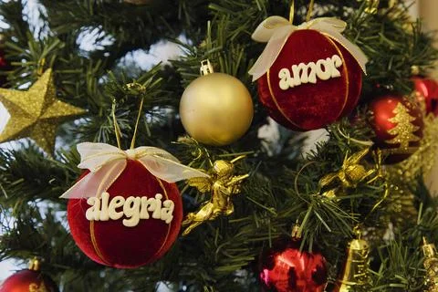 A tree with two red balls on it that say "Allegra" and "Amor" Stock Photos