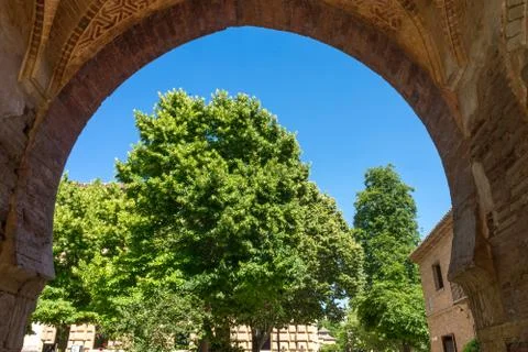 Tree viewed through an Arch at the Alhambra Palace in Granada, Spain, Europe Stock Photos