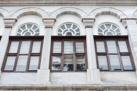 Tree windows on Vintage architecture classical facade of a historical buildin Stock Photos