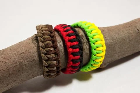 Tree wrapped paracord bracelets Stock Photos