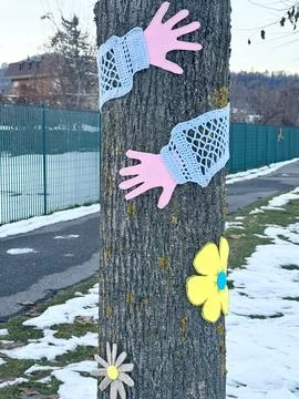 Tree Wrapped with Yarn and Pom-Pom Decorations. Stock Photos