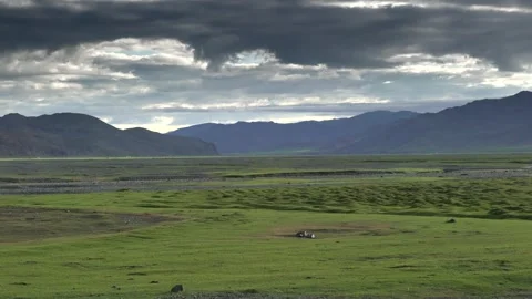 Treeless panoramic steppe shows wetlands plains and mountains - Rolling Terrain Stock Footage 339704355
