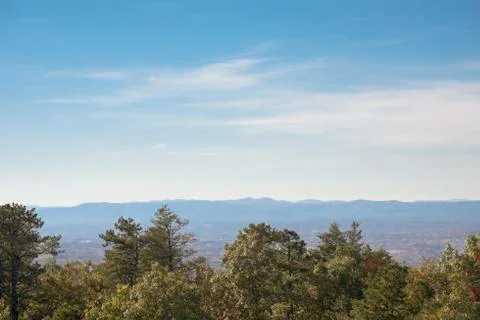 Trees and mountain range Stock Photos