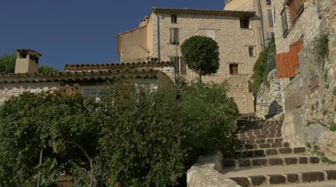 Trees and stone buildings in the old village of Tourrettes-sur-Loup Video stock 60120156