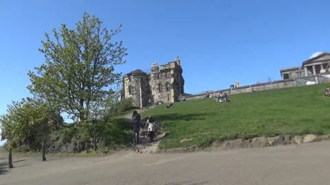 Trees, grass, and an old building in Edinburgh Video stock 94832001