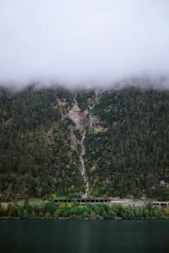 Trees mountains with clouds Stock Photos